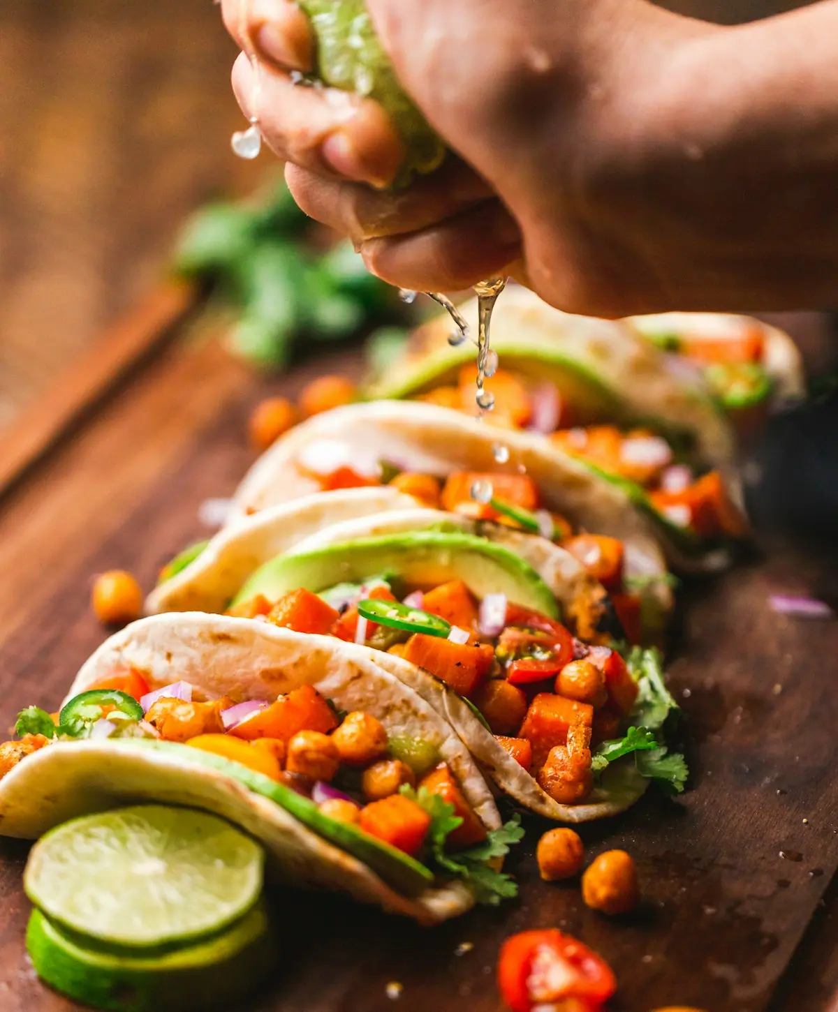 Soft tacos with grilled meat, onion, cilantro and lime wedges